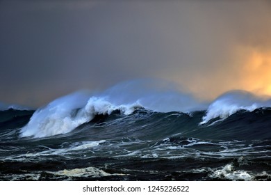 Stormy Waves Under An Orange Sky