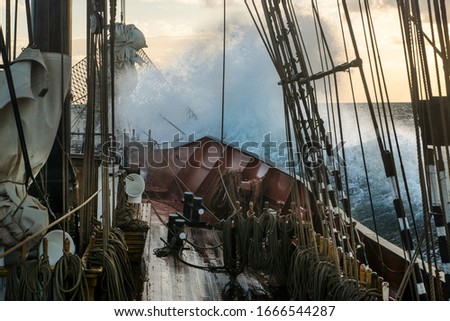 Stormy Weather and huge wave on an old sailing wessel