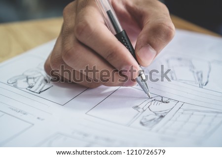 Storyboard or storytelling drawing creative for movie process pre-production media films script for video editors, Student hand writing graphic organizer in form of illustrations displayed in sequence