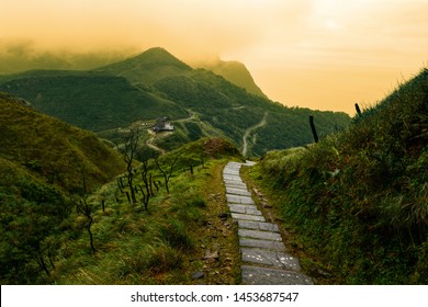 Storybook-like pathway through a misty mountain landscape in Taiwan's Yilan County
