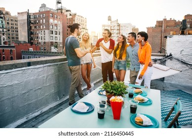 Storytelling Image Of A Group Of Teenagers Making Party On A Rooftop In New York City. Concept About Lifestyle And Youth