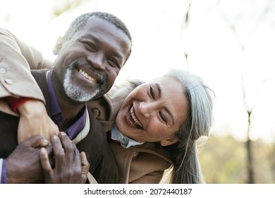 Storytelling image of a multiethnic senior couple in love - Shutterstock ID 2072440187