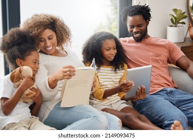 Its storytime. Shot of a young family spending time together and using a digital tablet at home.
