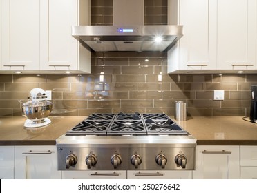 Stove Closeup In Modern Kitchen Interior With Stainless Steel Gas Cook-top.