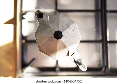 Stovetop Espresso Maker In A Sunlit Kitchen. Close Up. Shallow Depth Of Field. Overhead Shot.