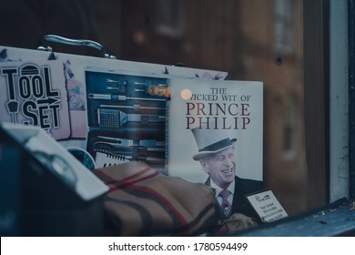 Stow-on-the-Wold, UK - July 6, 2020: The Wicked Wit Of Prince Philip Book On A Window Display Of A Shop In Stow-on-the-Wold, A Market Town In Cotswolds Build On Roman Fosse Way, Selective Focus.