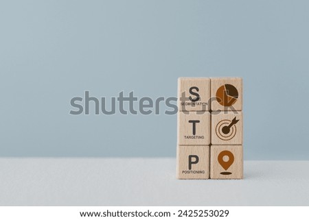 STP text ,abbreviation for Segmentation, Targeting, Positioning, and icon on wooden cube blocks. For marketing analysis, customer target, customer persona concept 