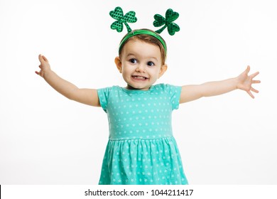 St.Patrick's day clover head decoration on an excited toddler girl - Powered by Shutterstock