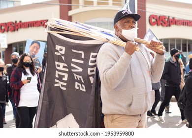 St.Paul, Minnesota, United States, 04-11-2021: Older Black Man Holding A Black Lives Matter Sign, During The George Floyd And Justin Teigen Protest.