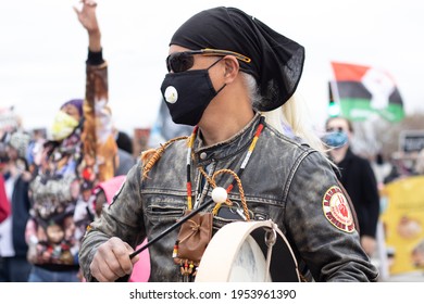 St.Paul, Minnesota United States, 04-11-2021: Native American Man Playing The Drums At A George Floyd And Justin Teigen Protest.