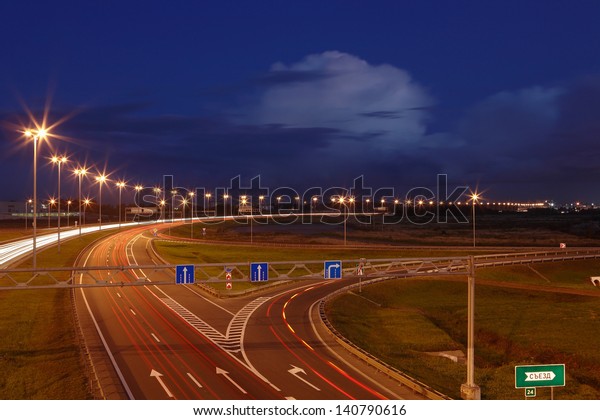 ST-PETERSBURG, RUSSIA - SEPTEMBER 17: Ringway St\
Petersburg, September 17, 2009. The mast lighting on the night\
road. Electric lights in the night highway. Road lighting lanterns.\
Russian roads.