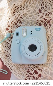 St.Petersburg, Russia- September 18, 2022: Blue Instax Mini 8 On The Nice Background. Camera With Instant Photo Printing.