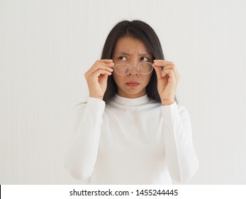 Strabismus Or Crossed Eye And Amblyopia And Diplopia In Asian Woman With Hold Glasses. Cause Of A Failure Of The Two Eyes