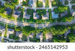 Straight aerial view suburban houses with parallel residential streets and back-alley suburbs Dallas Fort Worth metro complex, medium density subdivision large lots size, warm light, aerial view. USA