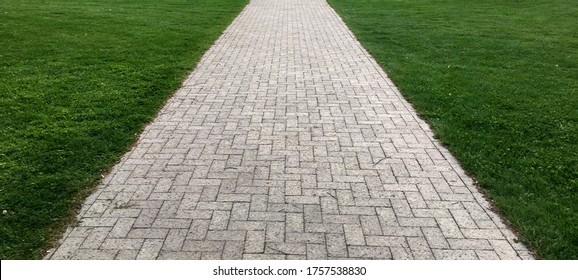 Straight Brick Path Through Grass