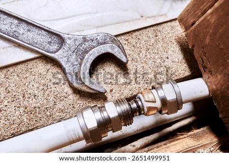 Straight compression fitting is inserted by nipple into multilayer pipe with compression ring on end, then nut will be tightened to compress compression ring.
