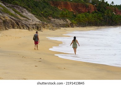 A Straight Couple Walking Along The Beach Of Trancoso In Bahia