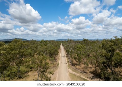 Straight Dirt Road Through A Country Bushland Landscape, High Perspective Drone Aerial