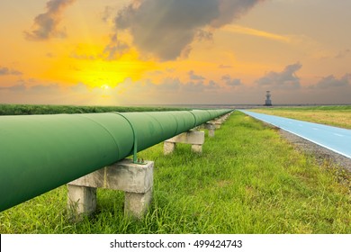 Straight Line Of Potable Water Pipe On Sunrise.