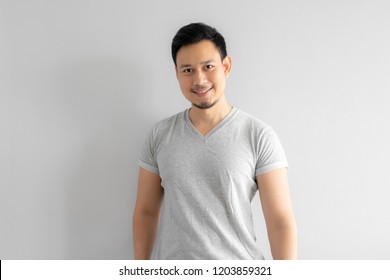 Straight portrait of Asian man with a bit of smile.