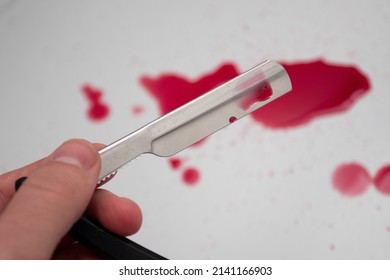 Straight Razor And Drops Of Blood