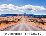 Straight road to horizon in high desert landscape of Davis Mountains, Texas, US