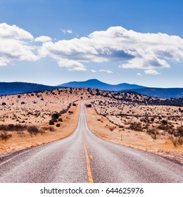 Straight Road To Horizon In High Desert Landscape Of Davis Mountains, Texas, US