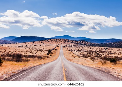 Straight Road To Horizon In High Desert Landscape Of Davis Mountains, Texas, US