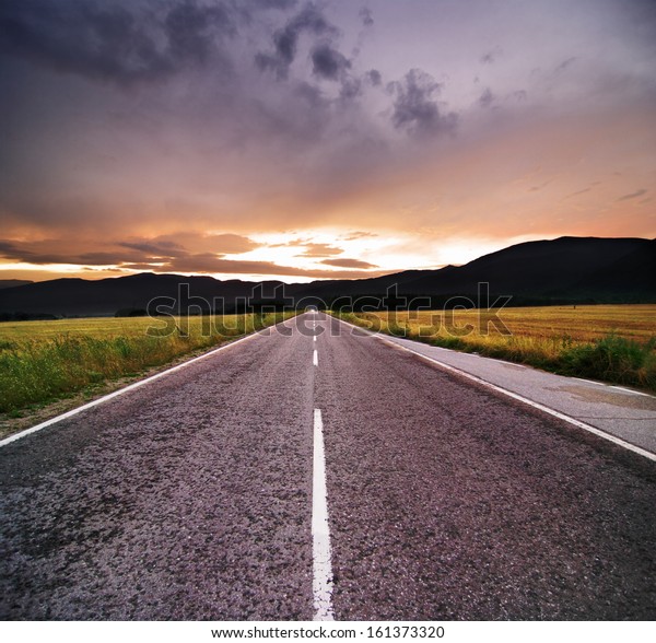 straight road at the\
sunset
