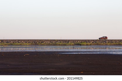 Straight Road And Tourist Car In Iceland