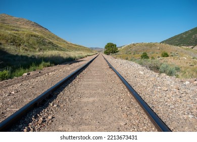 A Straight Shot Of A Railway With Leading Lines Through A Canyon