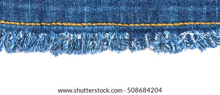 Straight simple stitch with orange thread on blue denim cotton fabric with fringe edge, on  white background.  Denim ribbon at the top of the image, the white background in the lower part
