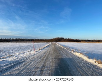 Straight Wintery Road In Uppland Sweden