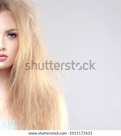 Straightening, smoothing and treatment of the hair.  One side of the head has tangled and unbrushed hair.