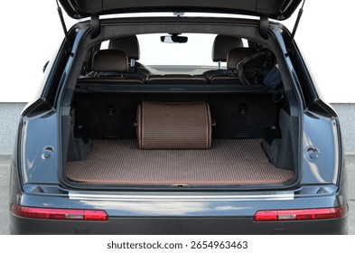 Straight-on view of an SUV’s open trunk lined with brown patterned mats and a structured storage bag. Rear seats are upright, showing the full layout of the clean and functional cargo space