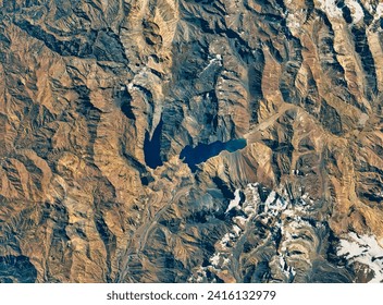 A Strained Water System in Chile. As a persistent drought drags on, water levels are dropping at a key reservoir that supplies Santiago. Elements of this image furnished by NASA. - Powered by Shutterstock