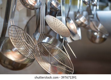 strainers ladles and kitchen accessories hanging
