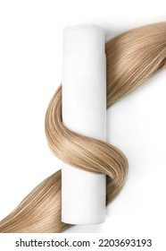 A strand of blond hair with a bottle of shampoo on a white background. Close-up.
