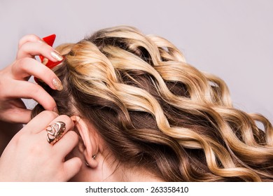 Strand of curly blond hair on his arm - Shutterstock ID 263358410