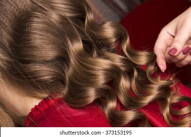 strand of curly blond hair on his arm  - Shutterstock ID 373153195