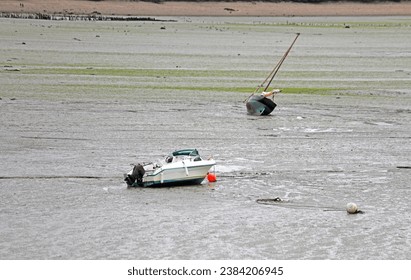 Stranded boats on the seabed during low tide in the town Cancale in France without people - Powered by Shutterstock