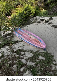 Stranded canoo by the beach