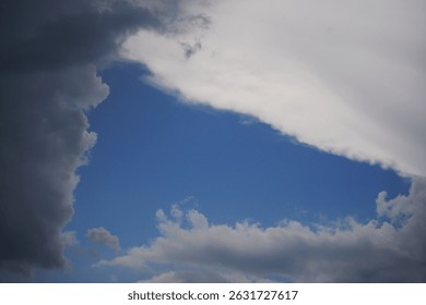 strange cloud hole in triangular shape forming an open blue sky area