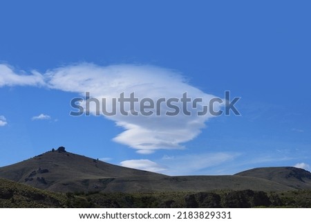 strange clouds on the background of the mountains
