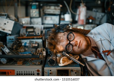 Strange Engineer Sleeping On Devices In Lab