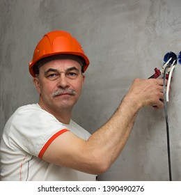 Strange Man With A Stern Face Cuts The Wiring. Produces Deversion