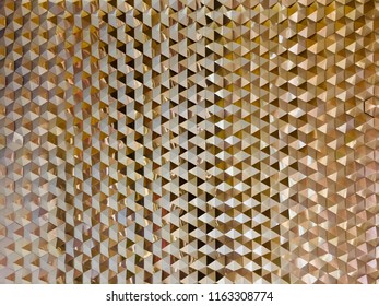 Strange reflection wall pattern. Reflective gold metal wall background..