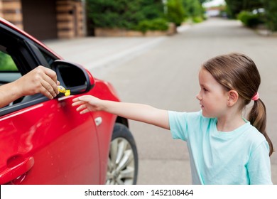 Stranger In The Car Offers Candy To The Child. Kids In Danger. Children Safety Protection Kidnapping Concept. 