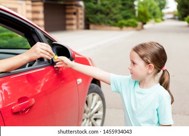 Stranger In The Car Offers Candy To The Child. Kids In Danger. Children Safety Protection Kidnapping Concept.