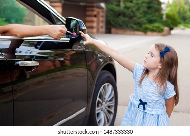 Stranger In The Car Offers Candy To The Child. Kids In Danger. Children Safety Protection Kidnapping Concept.